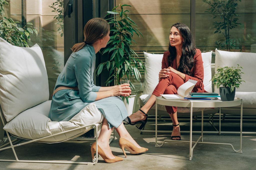 women talking in office lounge star interview method